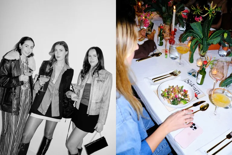 Black and white image of three influencers attending a Sakara event next to the tablescape with a salad, drinks, and fresh produce.