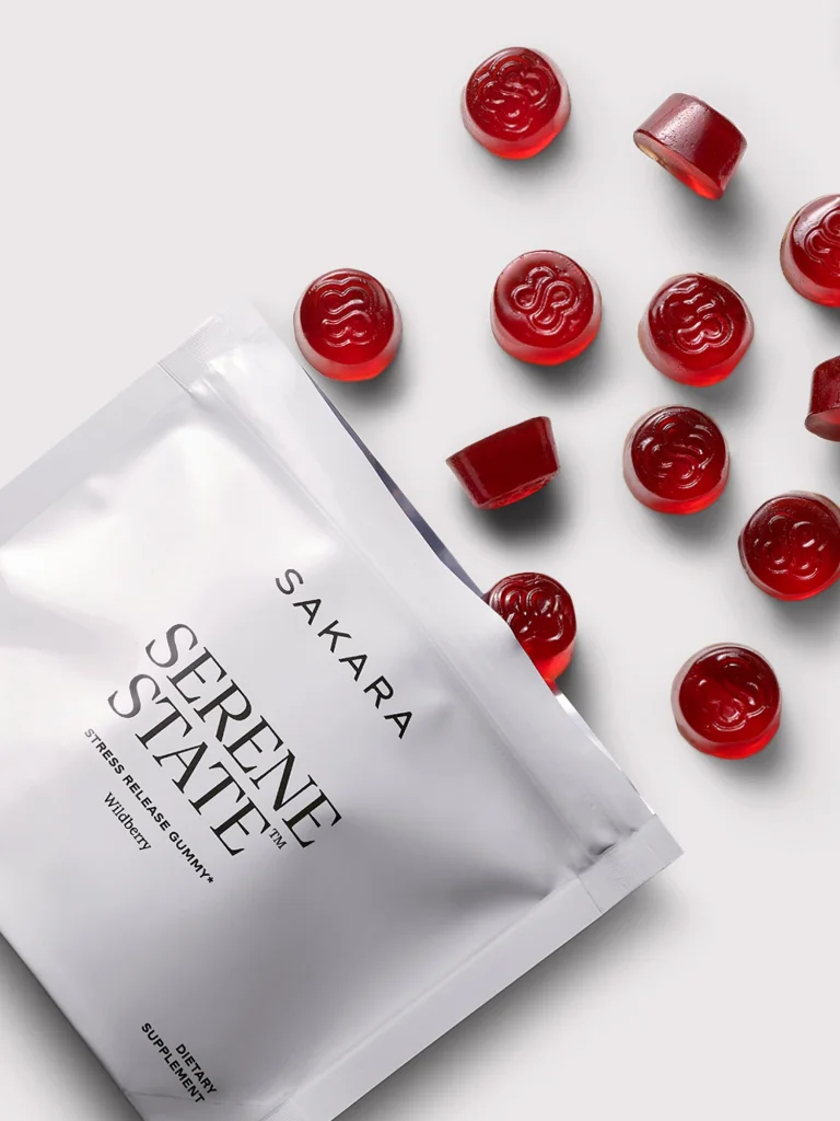 Sakara Serene State pouch displayed on a light background surrounded by red Serene State gummy supplements.